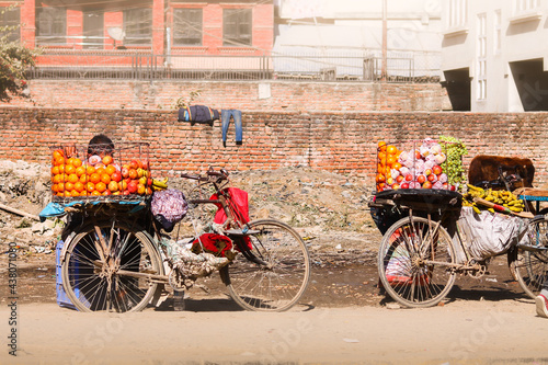 Fruit vendors in bicycles selling fruits on the streets of Kathmandu, Nepal © MarieXMartin