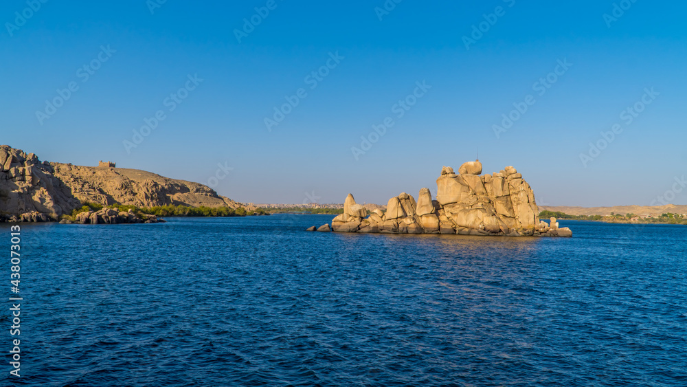 Rock formations and beautiful landscapes on the Nile River in the reservoir of the Aswan Low Dam near Agilkia Island, Egypt