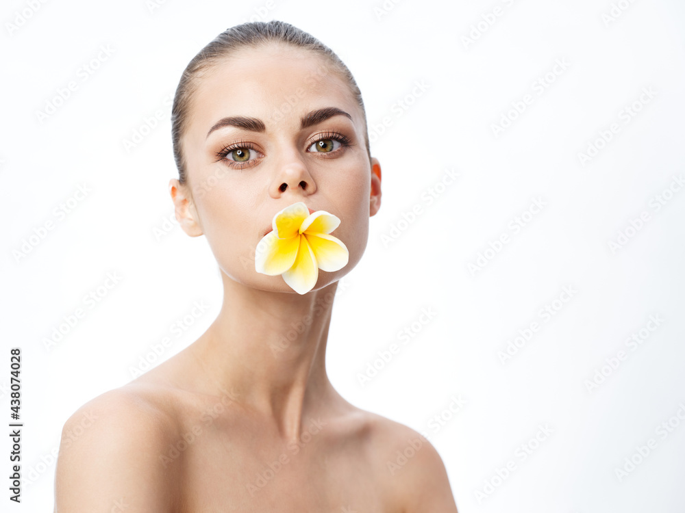 romantic woman with haircut on her head and flower in her teeth cropped view romantic woman with haircut on her head and flower in her teeth cropped view