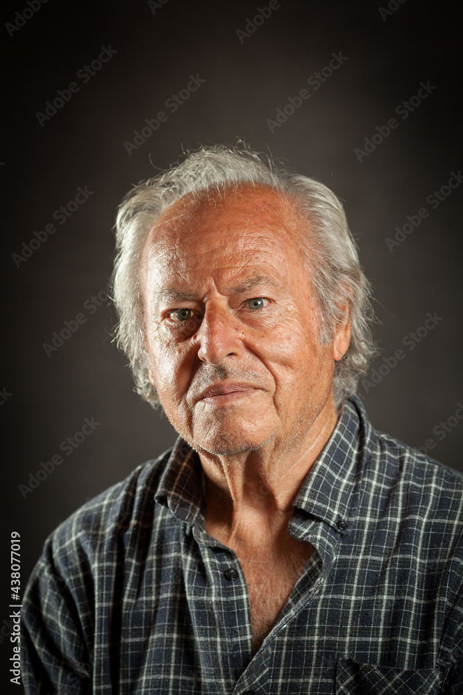 Studio portrait of an aged powerful, rugged man. Black backround Studio portrait of an aged powerful, rugged man. Black backround