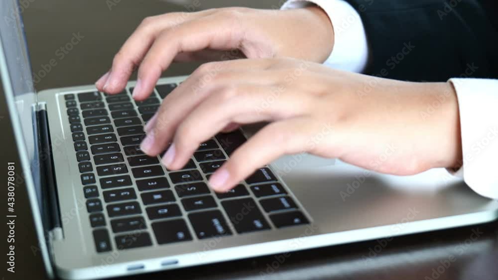 Close-up of businessman's hand typing on laptop Close-up of businessman's hand typing on laptop