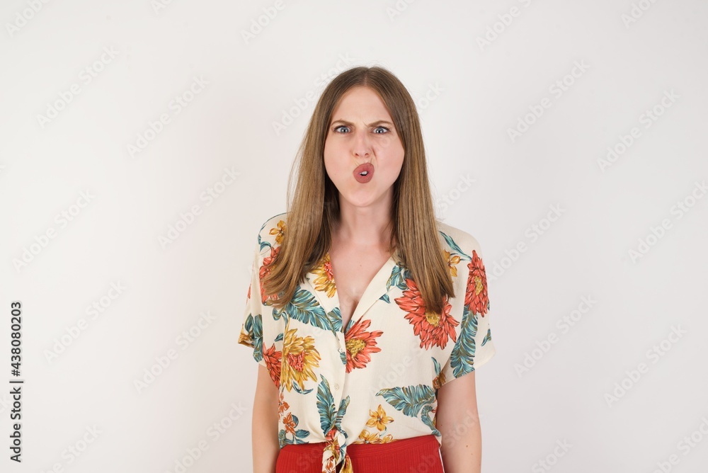 Brunette woman in casual clothes expressing disgust, unwillingness, dislike, disregard having tensive look frowning face. Cauasian woman with pleasant appearance looking indignant digusting something Brunette woman in casual clothes expressing disgust, unwillingness, dislike, disregard having tensive look frowning face. Cauasian woman with pleasant appearance looking indignant digusting something