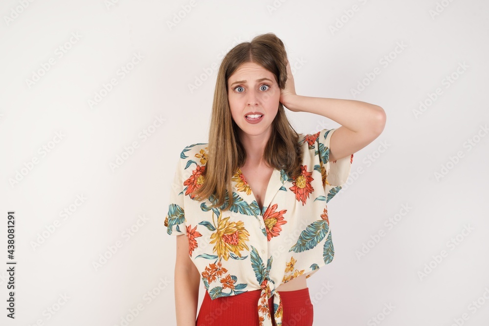 Worried and anxious woman can not remember anything. Portrait of confused cute girl wearing casual clothes, holding hand on hair and frowning, panicking, losing memory over gray wall Worried and anxious woman can not remember anything. Portrait of confused cute girl wearing casual clothes, holding hand on hair and frowning, panicking, losing memory over gray wall
