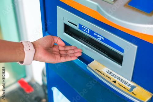 Close up of a hand unlocking a safe deposit box by turning a knob with numbers. Composite image between a hand photography