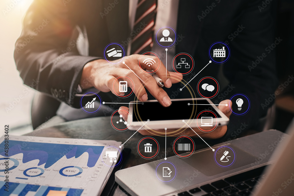 Business documents on office table with laptop and digital tablet and graph financial. Business documents on office table with laptop and digital tablet and graph financial.