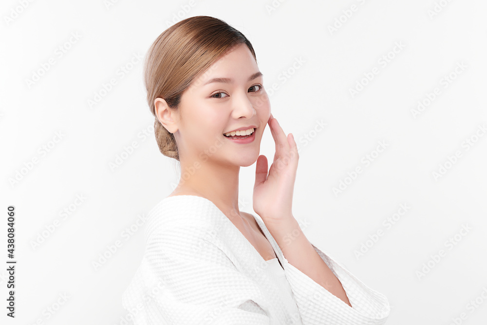 Beautiful young Asian woman wearing bathrobe on white background, Face care, Facial treatment, Cosmetology, beauty and spa Concept. Beautiful young Asian woman wearing bathrobe on white background, Face care, Facial treatment, Cosmetology, beauty and spa Concept.