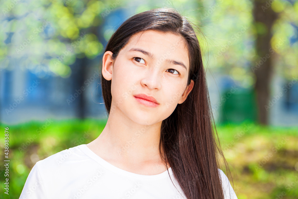 Portrait of a young beautiful girl in summer park Portrait of a young beautiful girl in summer park