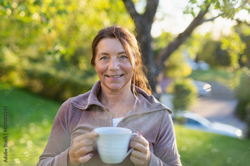 Woman relaxing with mug Woman relaxing with mug