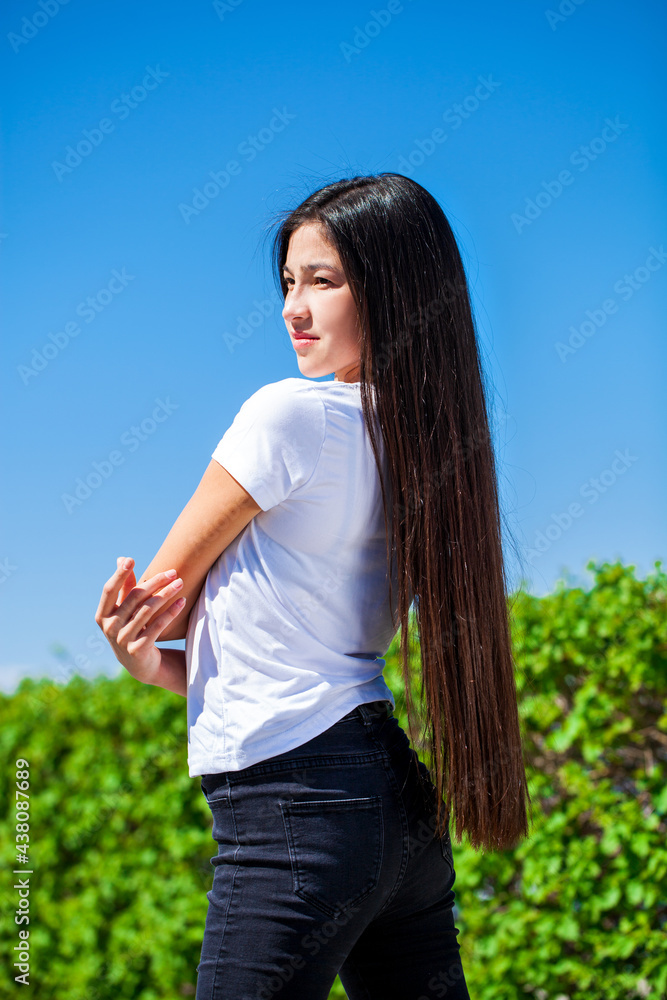 Portrait of a young beautiful girl in summer park Portrait of a young beautiful girl in summer park