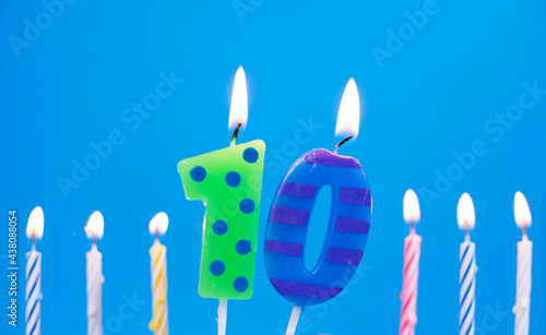 Burning birthday cake candle number 10. Happy Birthday background anniversary celebration concept photo