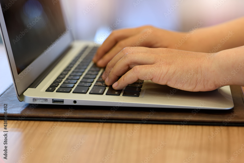 person typing on a laptop person typing on a laptop