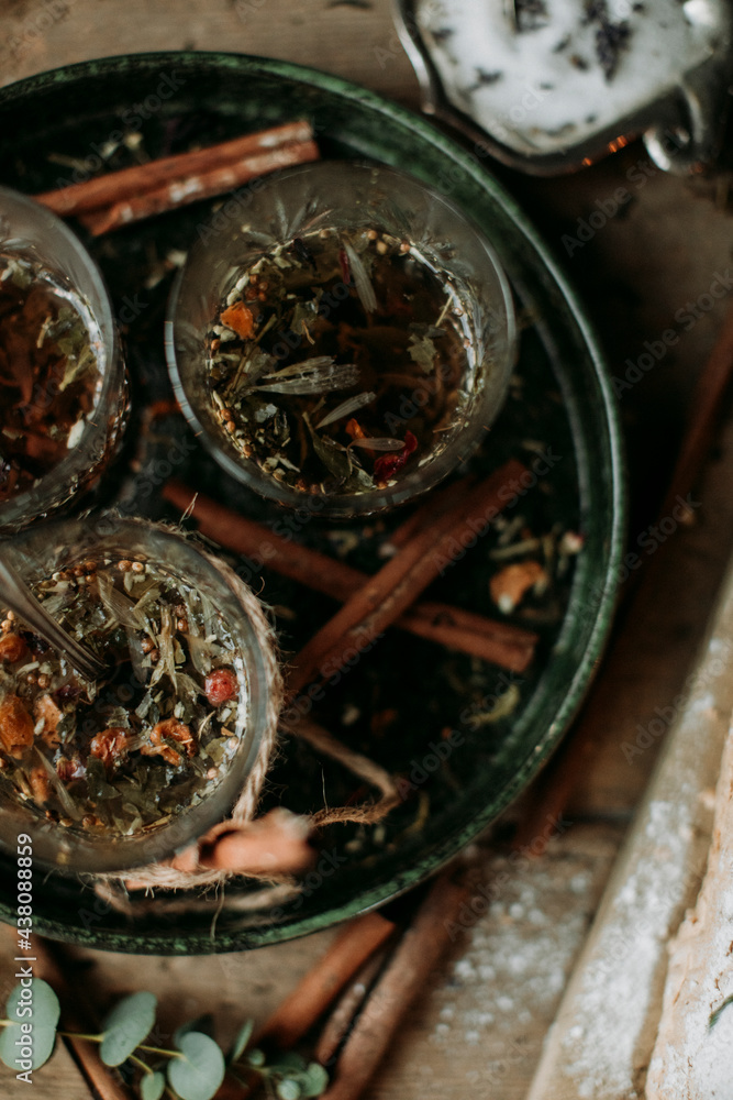 Drinks with herbs and cinnamon on tray Drinks with herbs and cinnamon on tray