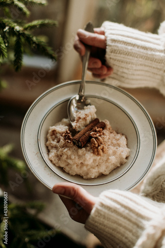 Woman eating porridge photo