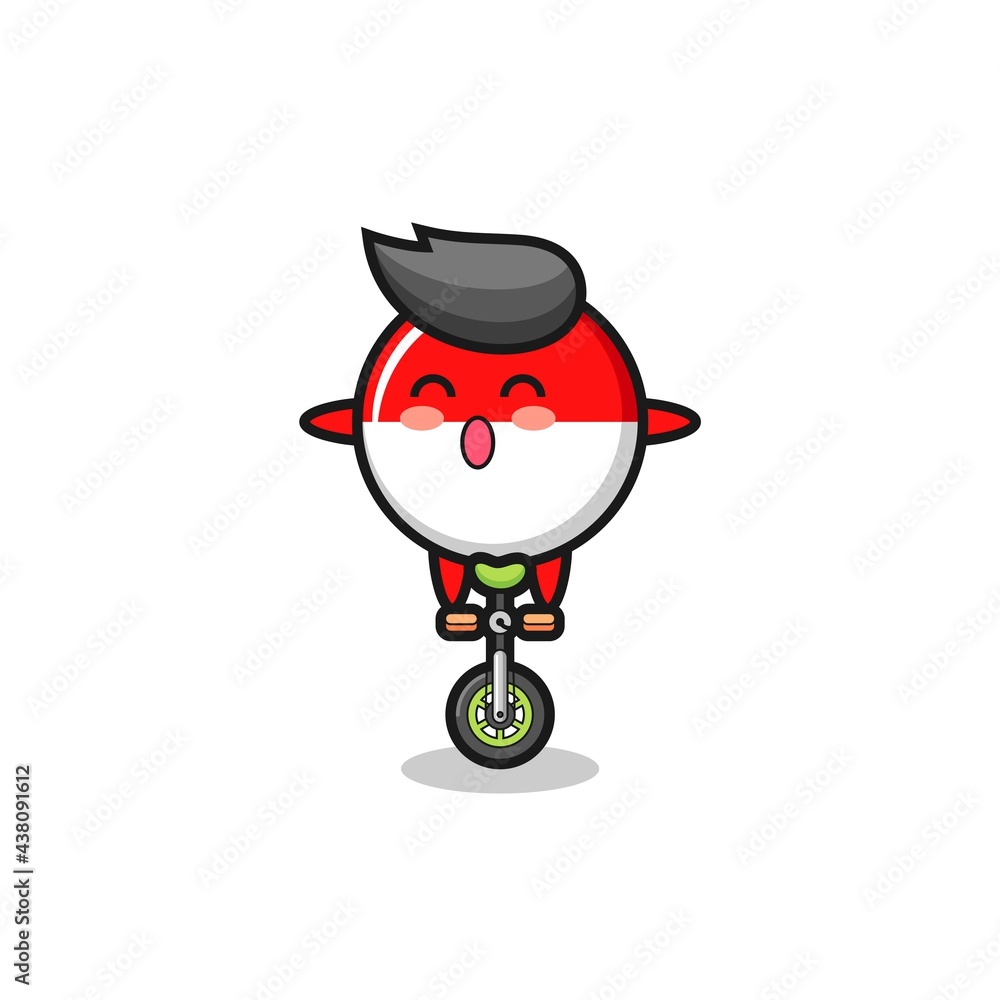 The cute indonesia flag badge character is riding a circus bike The cute indonesia flag badge character is riding a circus bike
