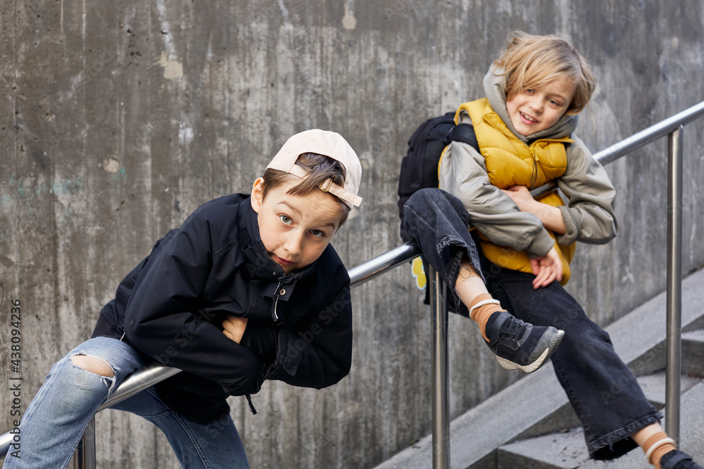 Children on stairs looking at camera Children on stairs looking at camera