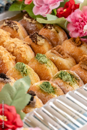 A bombolone or bomboloni is an Italian filled doughnut and is eaten as a snack food and dessert. This Bomboloni has many flavors like strawberry, chocolate, blueberry, etc.