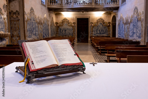 concept of church and prayer. a photograph of an empty church with an open book lying on the altar