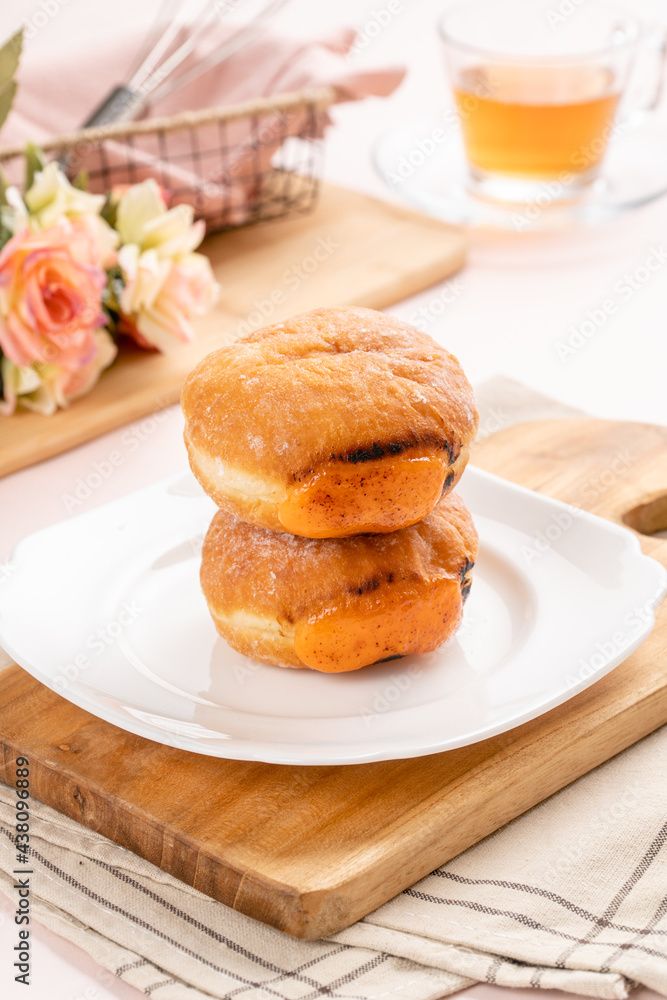 A bombolone or bomboloni is an Italian filled doughnut and is eaten as a snack food and dessert. This Bomboloni has many flavors like strawberry, chocolate, blueberry, etc. A bombolone or bomboloni is an Italian filled doughnut and is eaten as a snack food and dessert. This Bomboloni has many flavors like strawberry, chocolate, blueberry, etc.