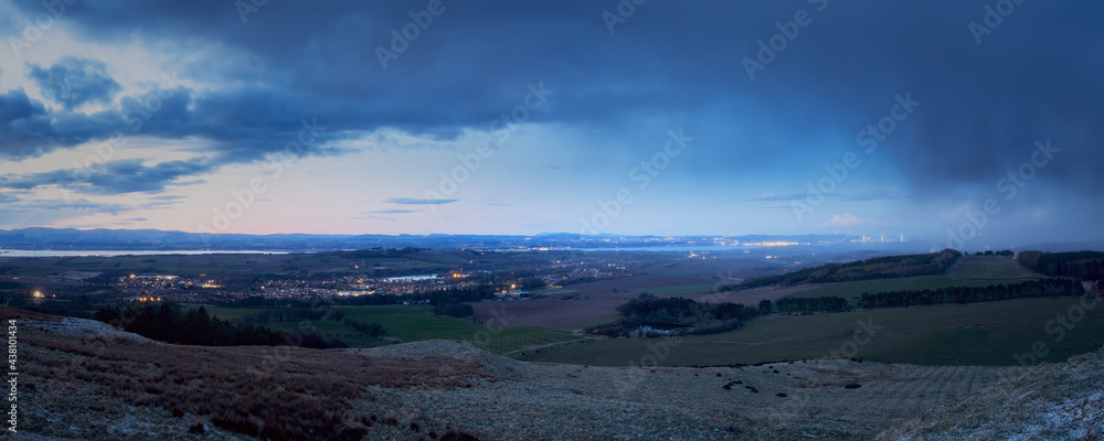 Top view of a rural Scottish landscape with town, sea and mountains. Linlithgow, Scotland