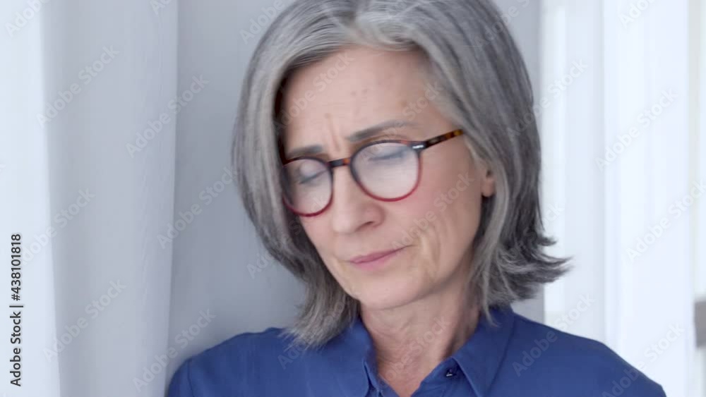 Nervous depressed woman waiting for husband looking at window with anxious Nervous depressed woman waiting for husband looking at window with anxious