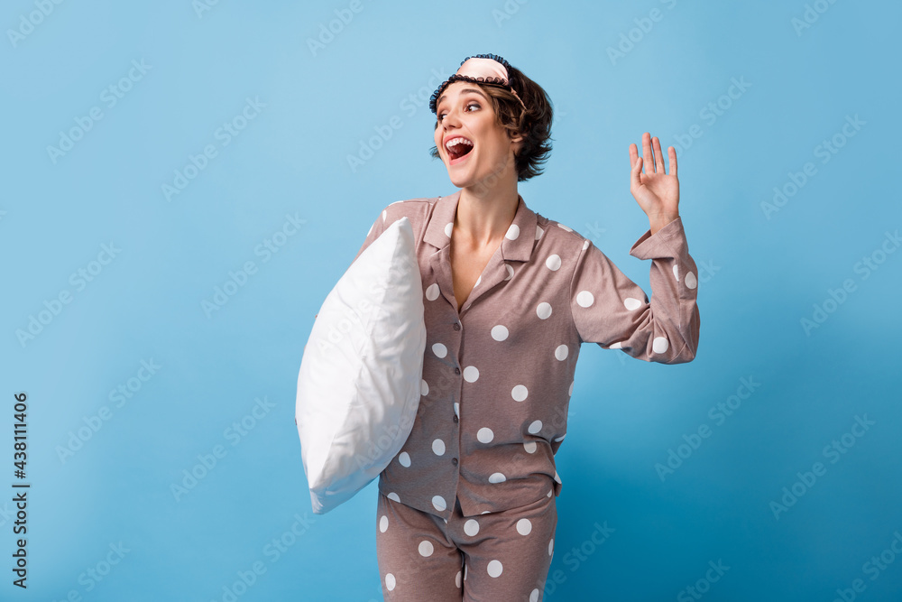 Photo of young pretty charming happy positive girl in eye mask look copyspace isolated on blue color background