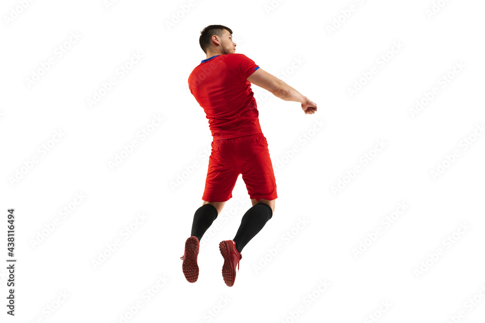 Powerful, flying above the field. Young football, soccer player in action, motion isolated on white background .