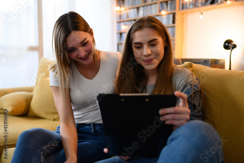 Young students studying for their exam together at home