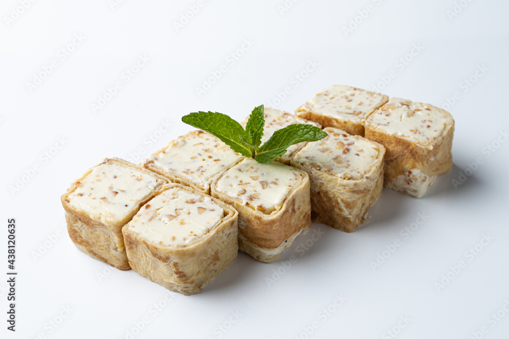 Gourmet crepe sushi rolls with cream cheese isolated on white background, top view Gourmet crepe sushi rolls with cream cheese isolated on white background, top view
