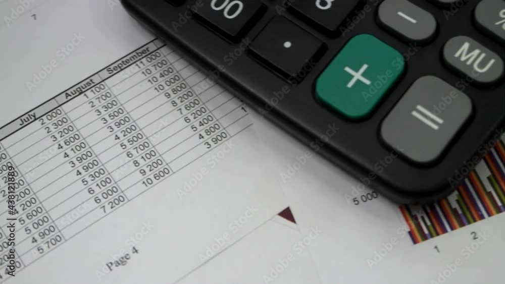 Financial report and calculator close up. Business analytics concept. Financial report and calculator close up. Business analytics concept.