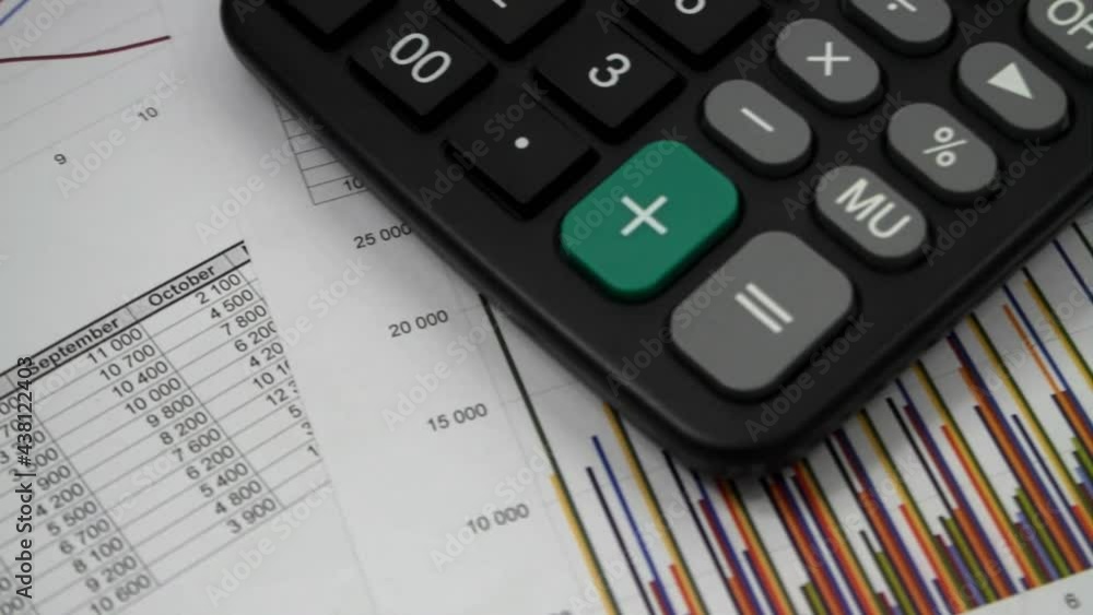Financial report and calculator close up. Business analytics concept. Financial report and calculator close up. Business analytics concept.