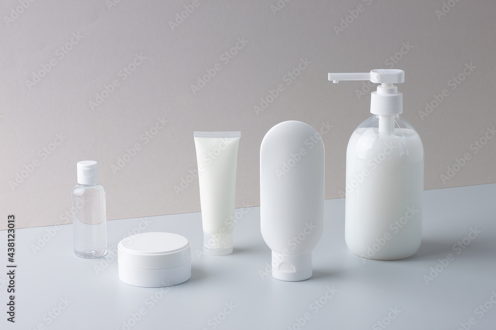 Cosmetic composition with skin care products on grey background. Close up. Cosmetic composition with skin care products on grey background. Close up.