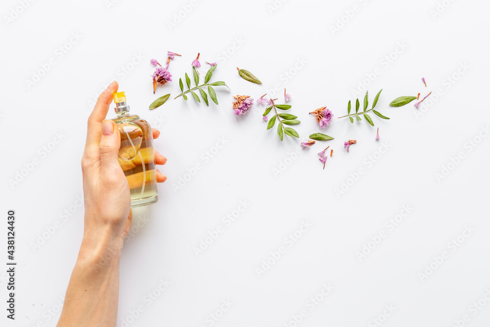 Hand spray perfume bottle with flow of flowers Hand spray perfume bottle with flow of flowers