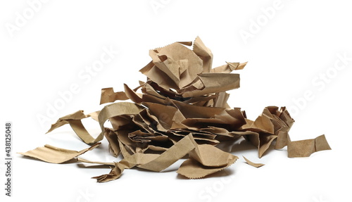 Torn paper bag pieces, scraps for recycling pile isolated on white background