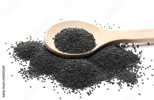 Black sesame seeds pile with wooden spoon isolated on white background