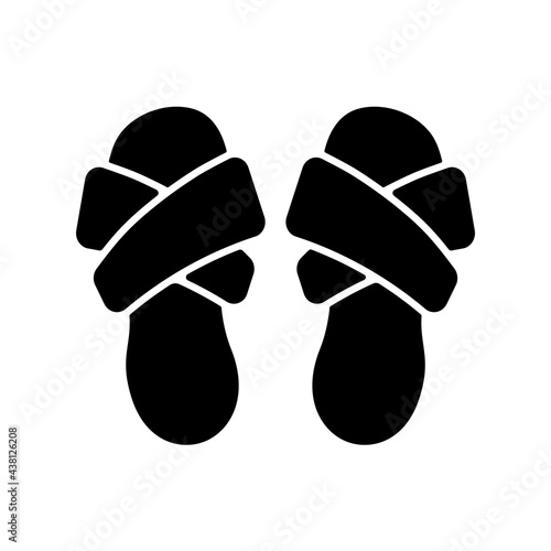Cross band slippers black glyph icon. Footwear for lounging at home. Comfortable shoes. Domestic flip flops. Homeware and sleepwear. Silhouette symbol on white space. Vector isolated illustration