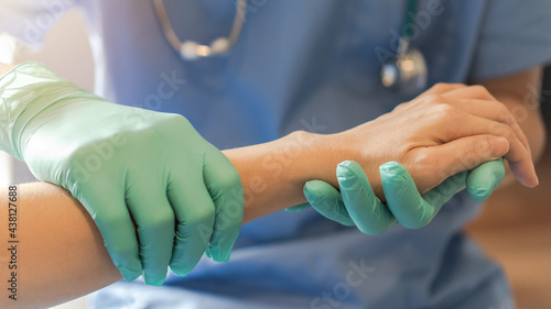Surgeon, surgical doctor holding patient hand in professional ER emergency operation room for health care trust, medical anesthetic safety by anesthetist or anesthesiologist healthcare support concept photo