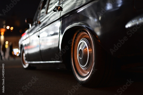 black soviet vintage car close-up on night city street © Oleksandr