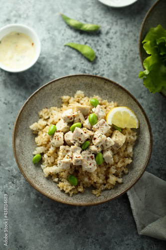 Healthy quinoa bowl with chicken and edamame beans