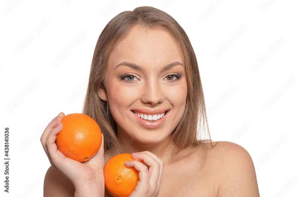 Portrait of young woman posing with oranges Portrait of young woman posing with oranges
