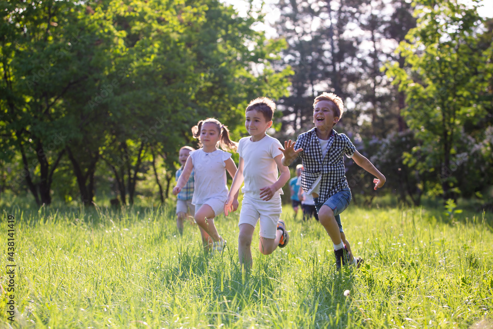 children play outdoors running and having fun children play outdoors running and having fun