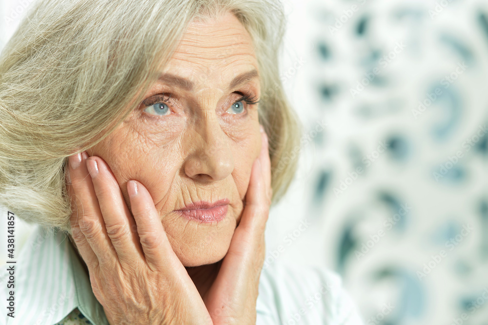 Close up portrait of sad ill senior woman Close up portrait of sad ill senior woman