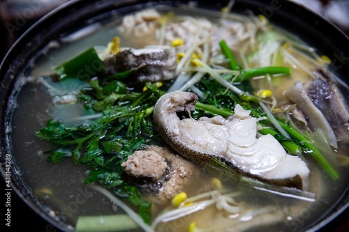 Cod, roe, intestines, vegetables, and bean sprouts boiled in a pot, Korean traditional food,