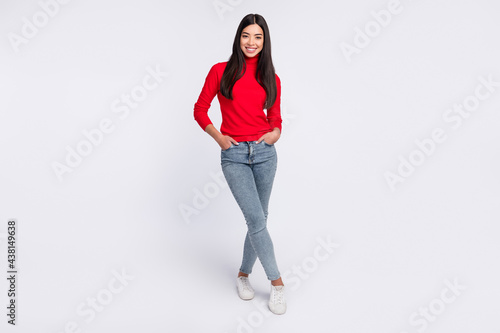 Full size photo of happy smiling charming young korean girl posing on camera isolated on grey color background