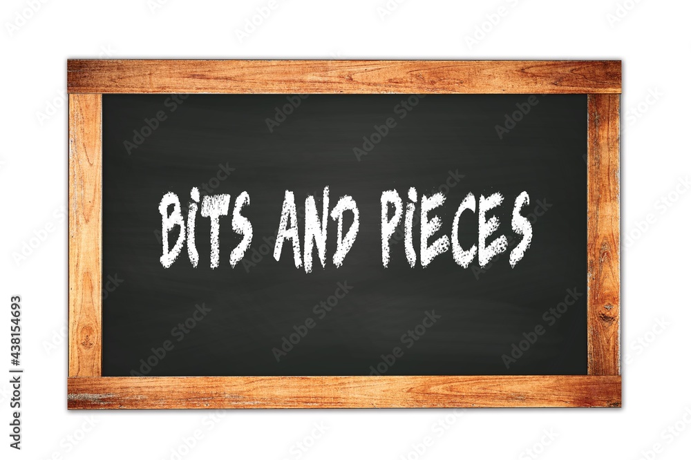 Fototapeta premium BITS AND PIECES text written on wooden frame school blackboard.