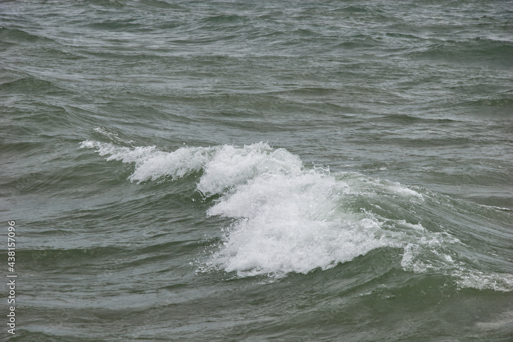 Turquoise white cap wave coming into shore Turquoise white cap wave coming into shore