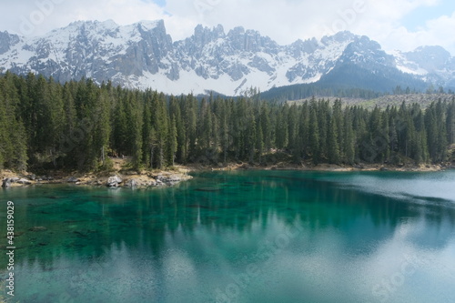 The fabulous alpine lake of Carezza in the Dolomites  Bolzano . Lovely place in the Italian Alps. Reflections in the water. Sunny spring day. Trentino Alto Adige