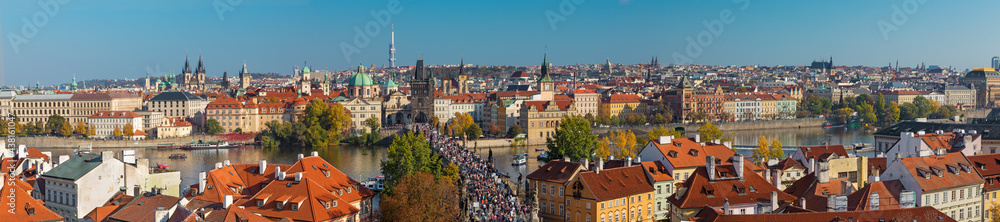 PRAGUE, CZECH REPUBLIC - OCTOBER 13, 2018: The panorama of the city with the Charles bridge and the Old Town  in evening light.