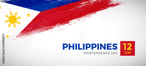 Happy independence day of Philippines with brush painted grunge flag background