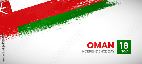Happy independence day of Oman with brush painted grunge flag background