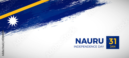 Happy independence day of Nauru with brush painted grunge flag background